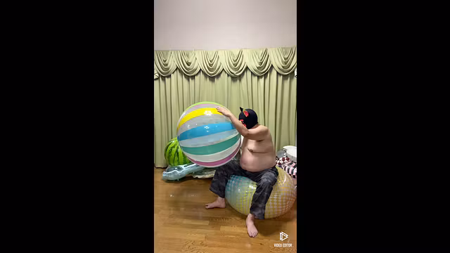Inflate two beach balls by mouth